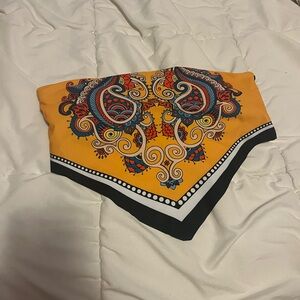 Bandeau style swim top with pads inside.